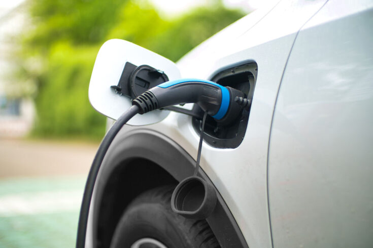 Electric car charging at power station